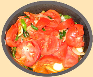  dish of chutney ingredients, tomatoes, garlic, chilies, cilantro, amongst others