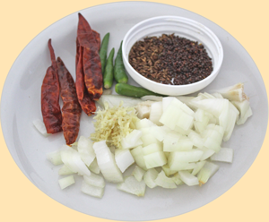 Some of the ingredients, onions, ginger mustard and cumin seeds and dry chilies